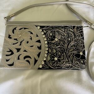 Sophisticated Silver and Black Clutch with Ornate Design